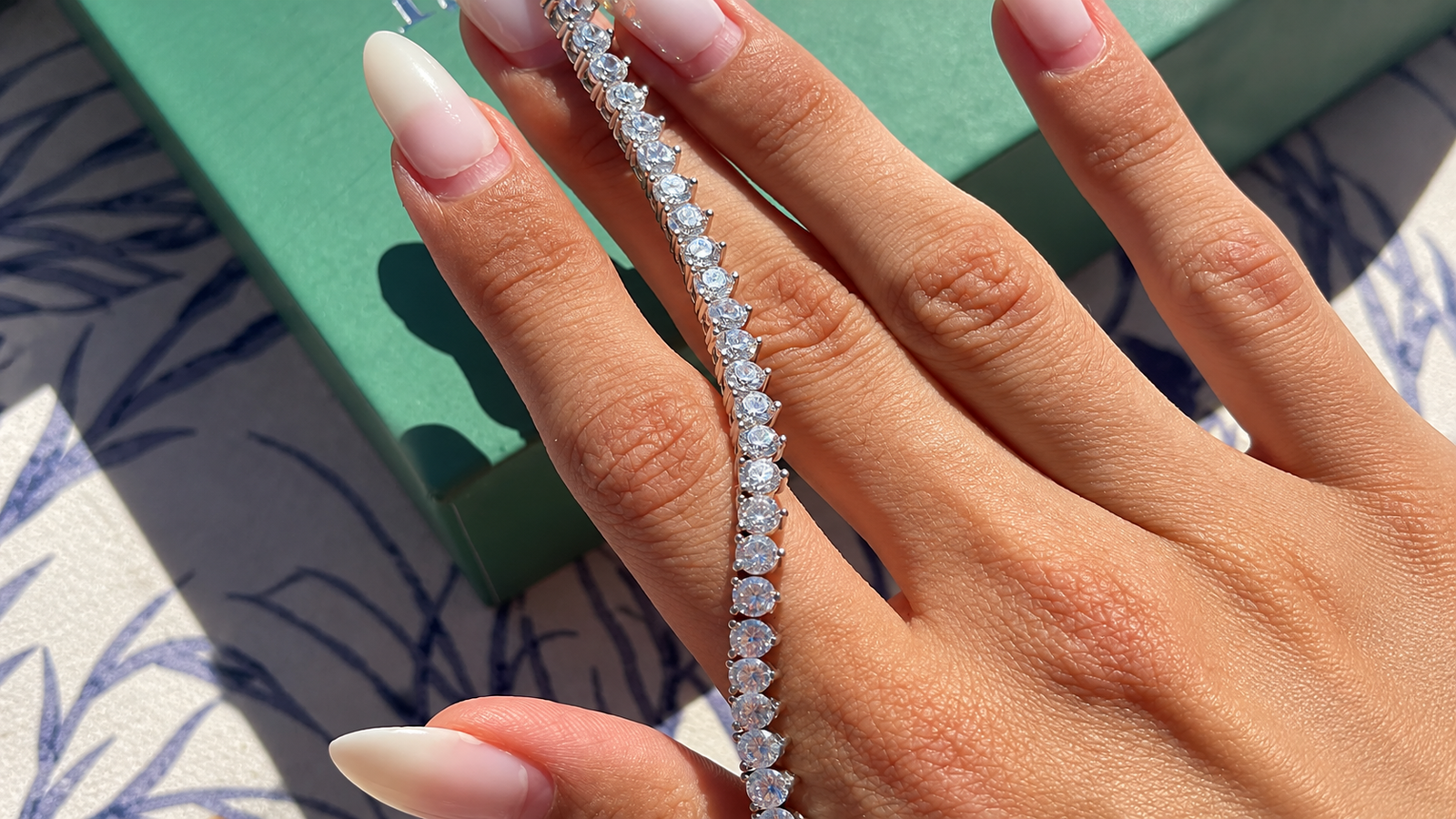 Tennis bracelet resting elegantly on a hand, showcasing affordable luxury jewelry for everyday style.