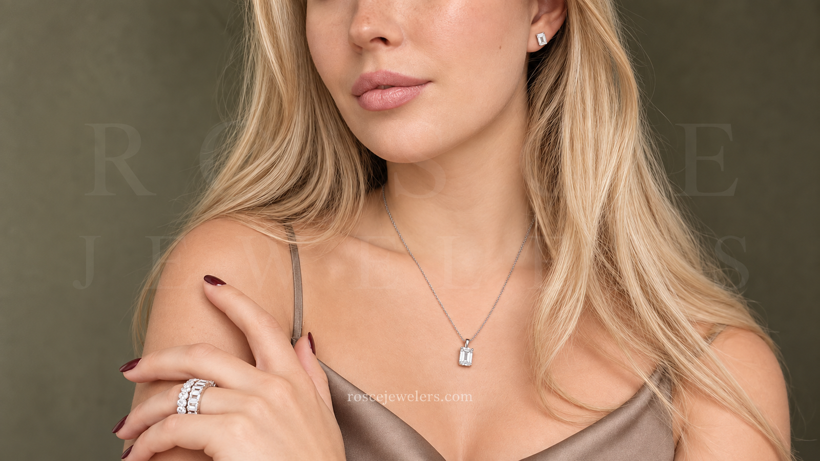 Blonde woman wearing a matching diamond necklace, earrings, and bracelet set, showcasing affordable luxury jewelry.