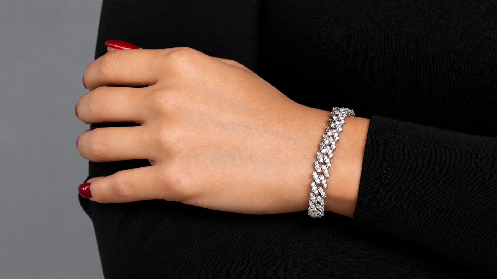 Hand wearing an elegant tennis bracelet, showcasing affordable luxury jewelry for everyday style.